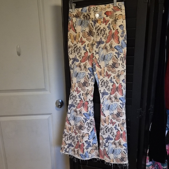 We The Free Denim - We The Free Butterfly Print Flared Pants in Cream, Blue, Red, Yellow